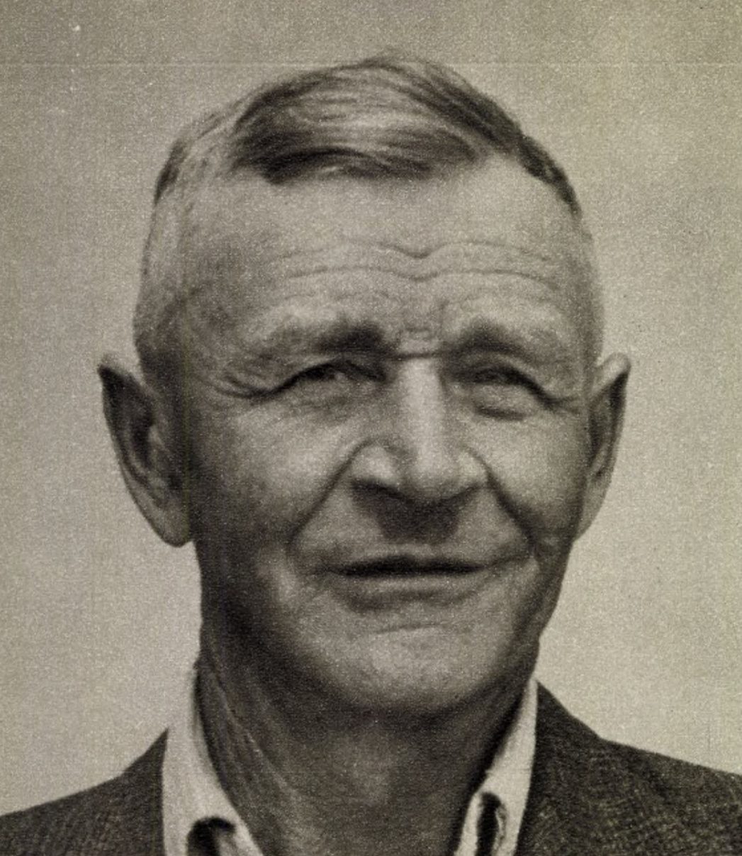 Frantisek Blaha, halftone print of a head and shoulders portrait, an older man with cropped grey hair in a tweed jacket and open shirt