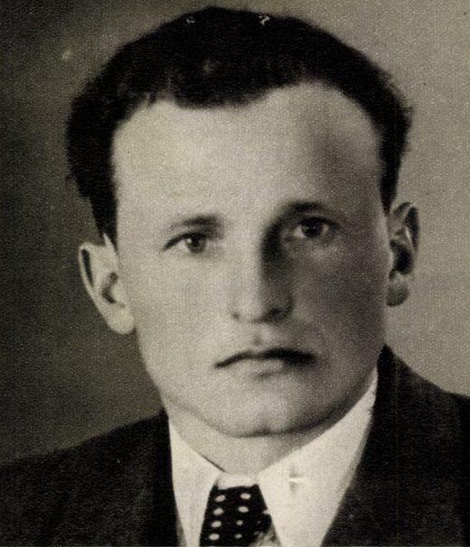 Josef Roupec, black and white head and shoulders portrait of a man with dark swept back hair, in a suit and spotted tie