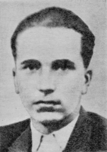 A grainy black and white portrait of a young man with dark hair combed back, in a jacket and an open shirt