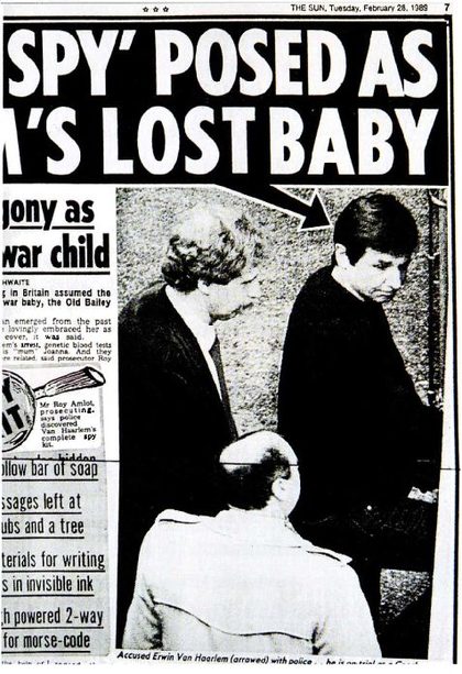 A tabloid page dated Tuesday, February 28, 1989, with the headline SPY POSED AS MUM'S LOST BABY over a photograph of a dark haired man walking between police officers, an arrow drawn to his head