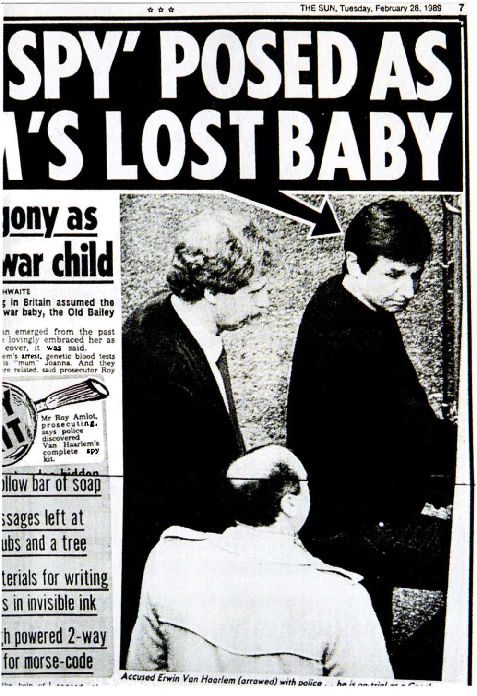 A tabloid page dated Tuesday, February 28, 1989, with the headline SPY POSED AS MUM'S LOST BABY over a photograph of a dark haired man walking between police officers, an arrow drawn to his head