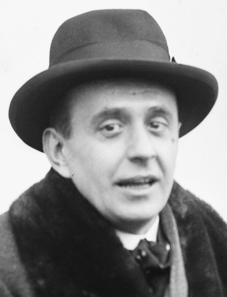 Jan Masaryk in a hat and fur-collared coat, smiling
