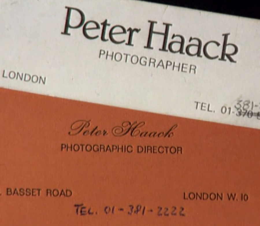 Two business cards reading Peter Haack, Photographer, London, a white one over a red one